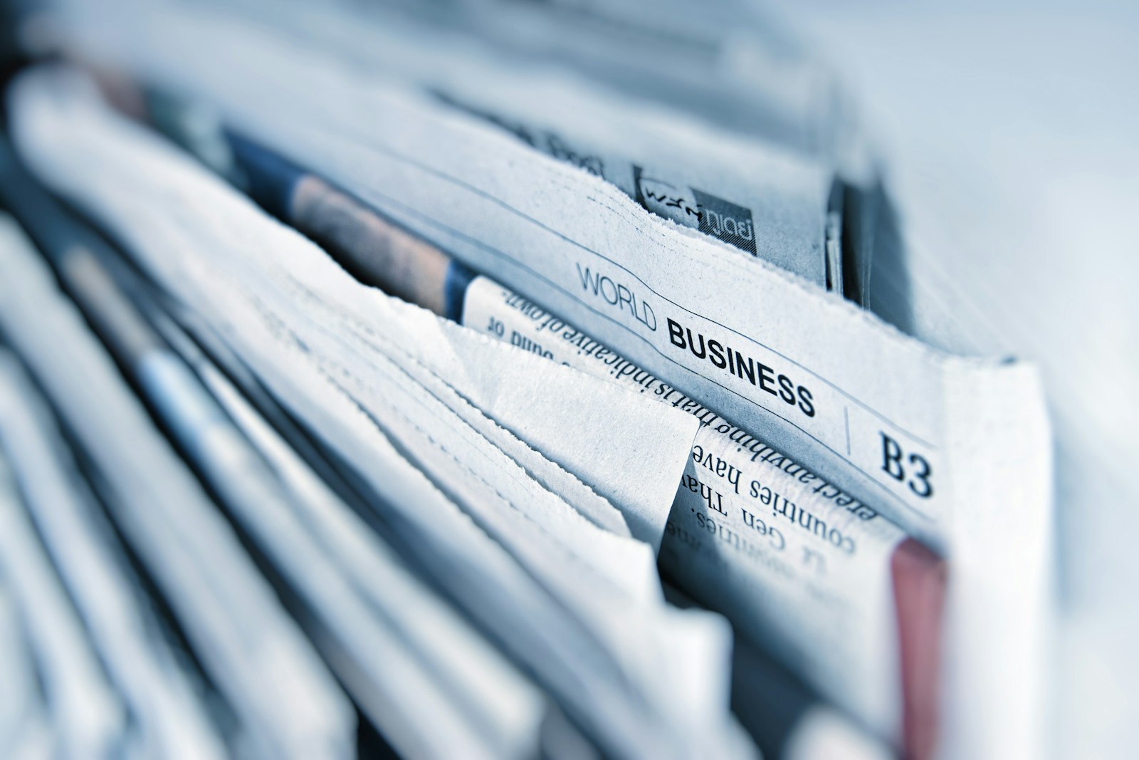 Newspapers stacked on a table